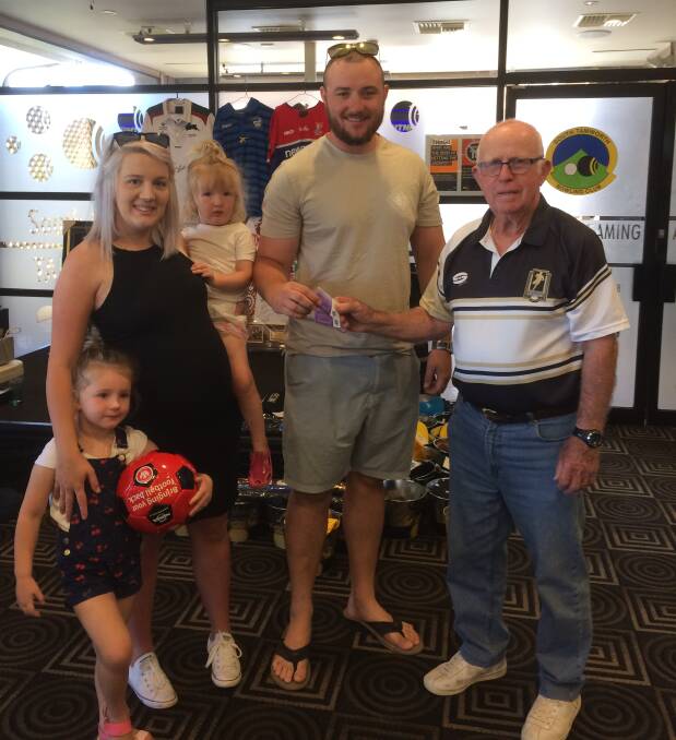 SUPPORT: Gabrielle, Teleah, Imogen and Thomas Michell are presented with food vouchers from Men Of League Foundation Tamworth president Kevin Robinson. Photo: Supplied
