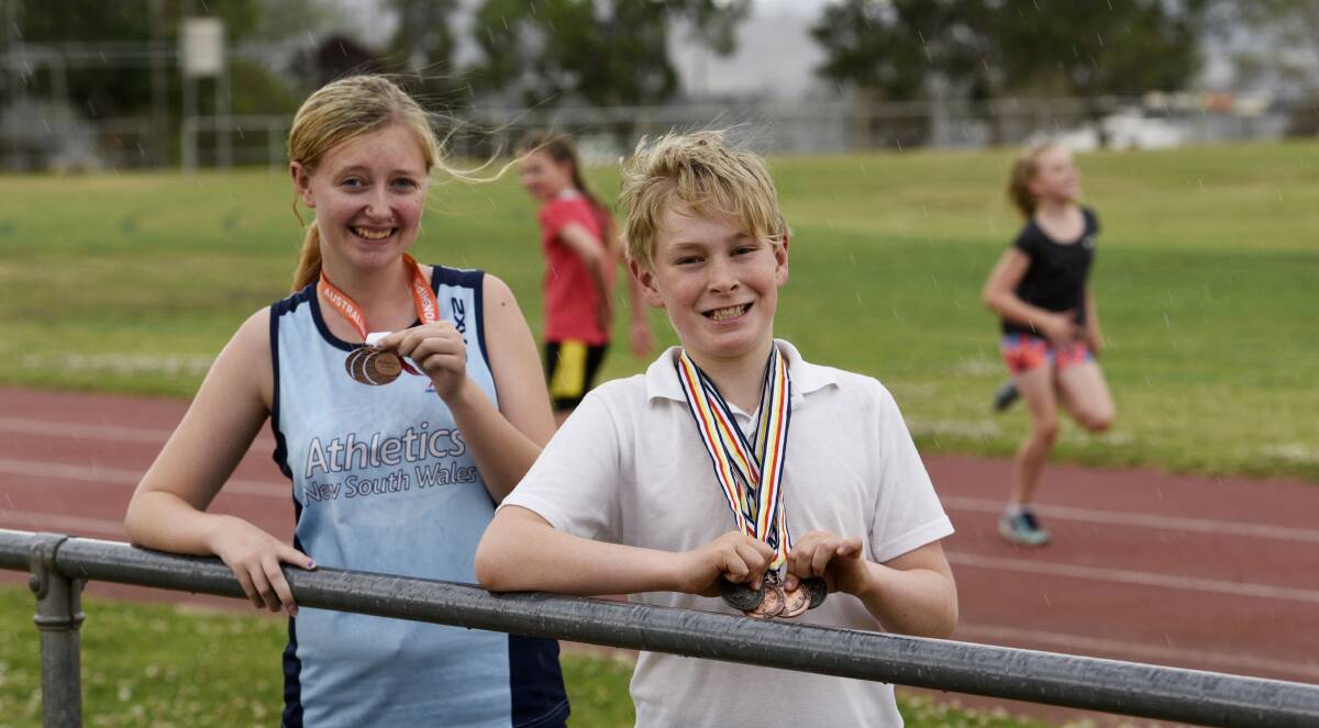 PERFORMING: Tayla Parker and Lachie Rasmussen show off medals the pair claimed over the past couple of months. Photo: Gareth Gardner
