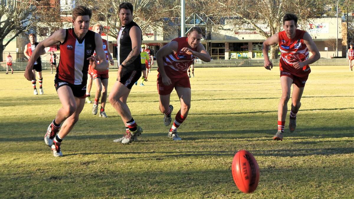 IN FORM: Ben Gregory hunts for a loose ball against the Swans earlier this season. The centre half forward had a big game against the Roos on Saturday.