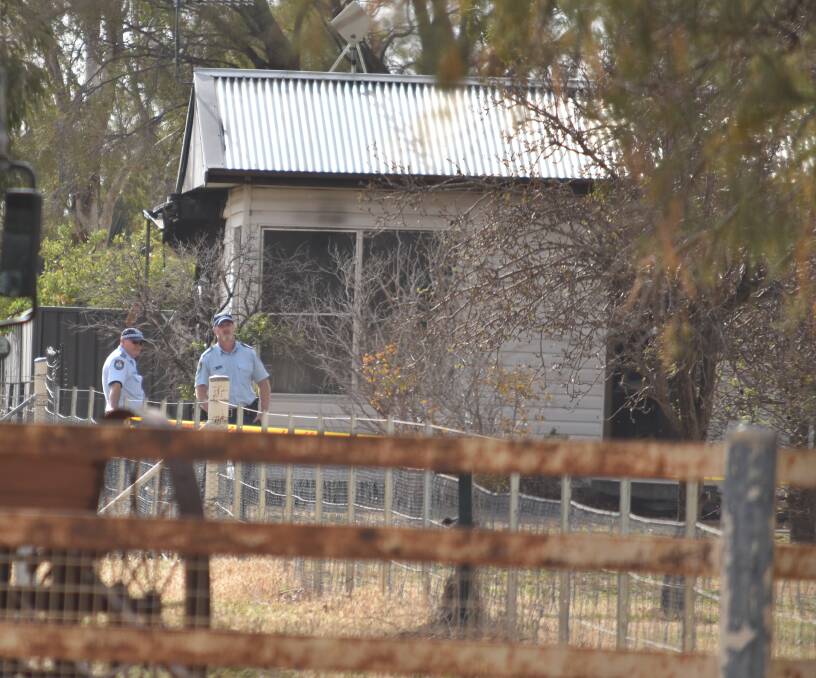 Crime scene: Police and fire crews at the Tamworth home on Thursday morning.