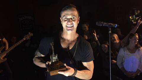 GOLDEN NIGHT: Shannon Noll with his Golden Guitar after the Tamworth concert.