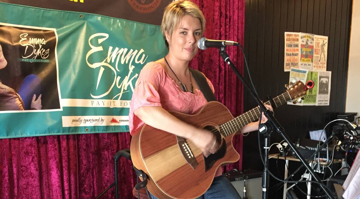 NEW MUSIC: Emma Dykes performs at the Tamworth Country Music Festival, and has been kept busy juggling nursing at Inverell District Hospital with her music career, which sees her playing across the region. Picture: Laurie Bullock