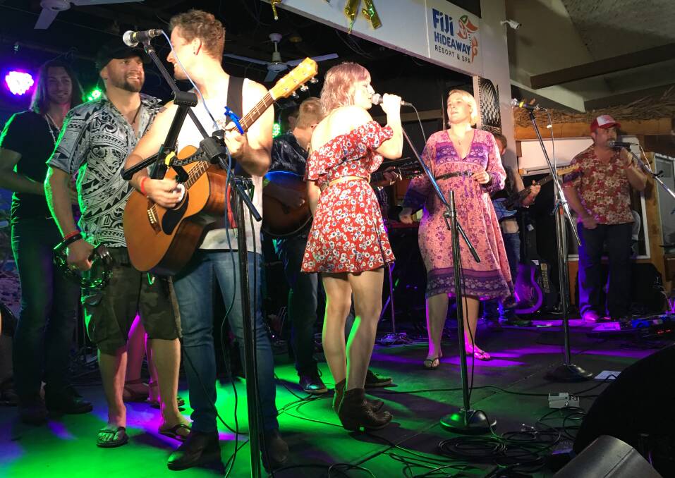 Artists (from left) Jonny Taylor (back), Luke Dickens, Liam Brew, Ashleigh Dallas, Catherine Britt and Pete Denahy on stage for the finale on the final night of Tunes in the Tropics.