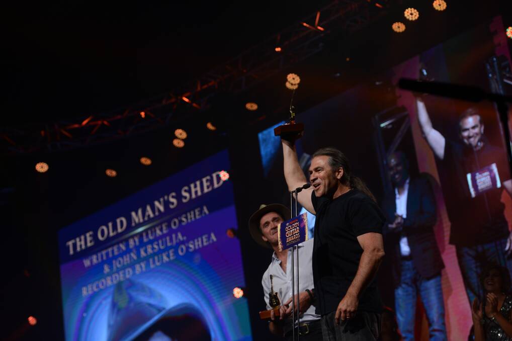 TOP SONG: John Krsulja accepts the Golden Guitar in January for The Old Man's Shed, written with Luke O'Shea at the songwriters retreat two years ago.