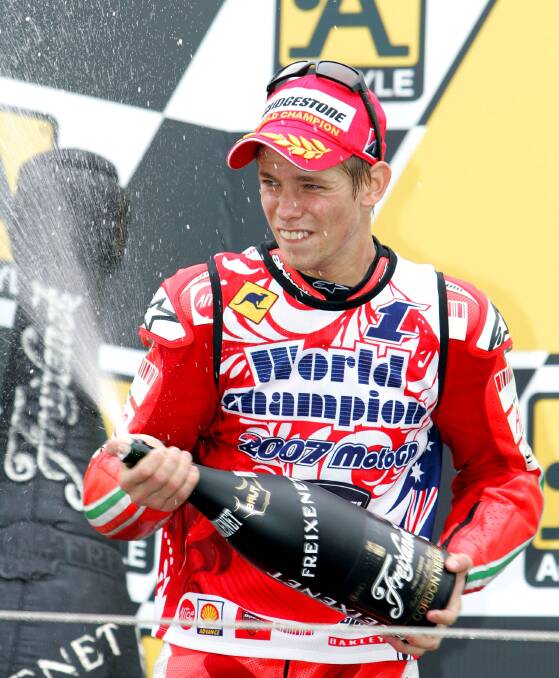  Stoner celebrates winning the 2007 MotorGP world championship. Photo: AP
