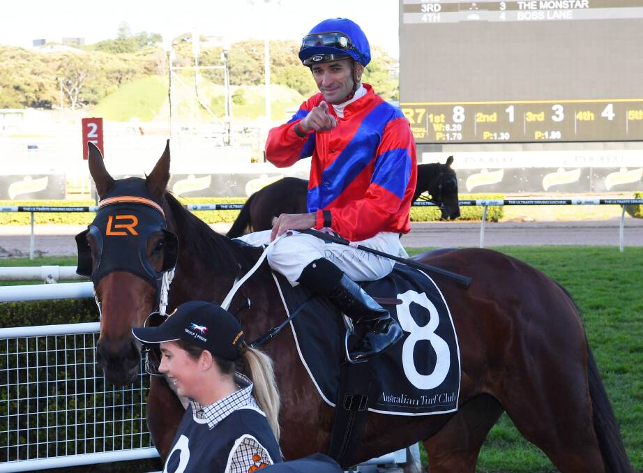WINNING FEELING: Corey Brown returns to scale after winning the Missile Stakes on Invincible Gem. Photo: AAP