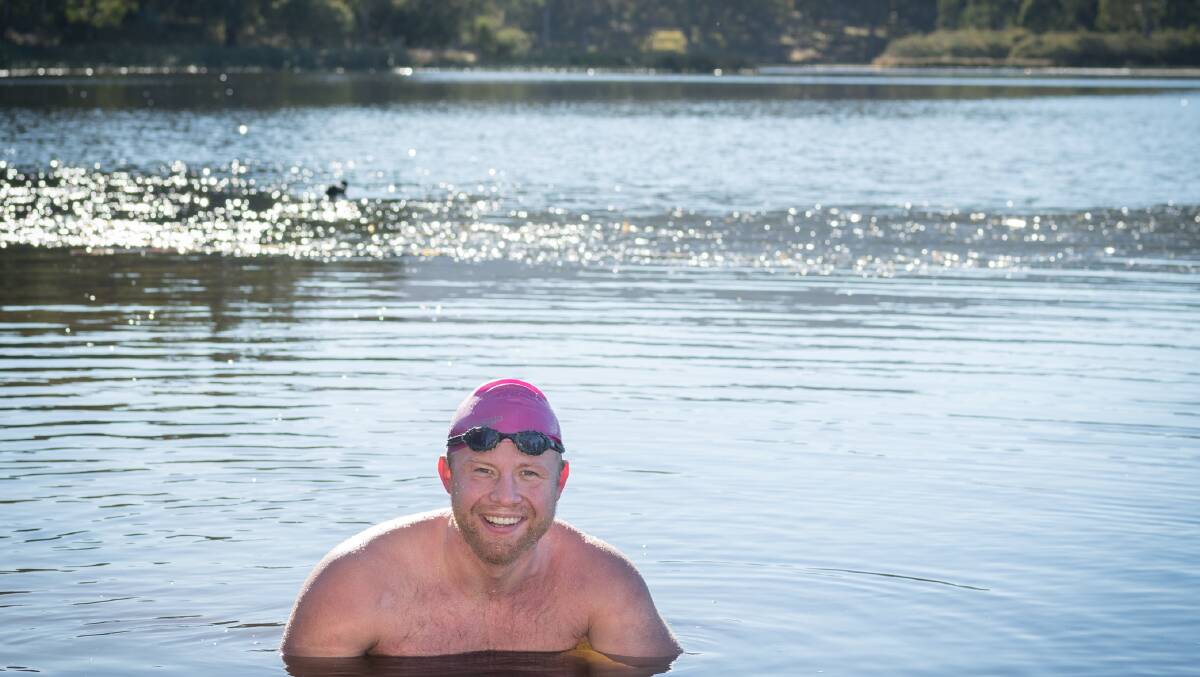 HUMAN SEAL: Endurance swimmer Tom Pembroke trains in the chilly Dumaresq Dam near Armidale.