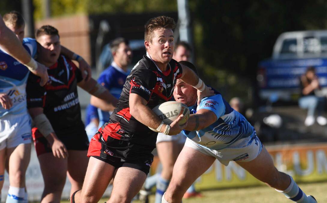  LEADER: Bears halfback Keiran Fisher in action against the Blues.