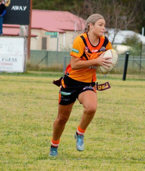 TIGRESS: Uralla's Brooke O'Halloran gains metres during the side's 38-0 defeat of Boggabri in Ladies League Tag action last Saturday. Photo: Contributed.