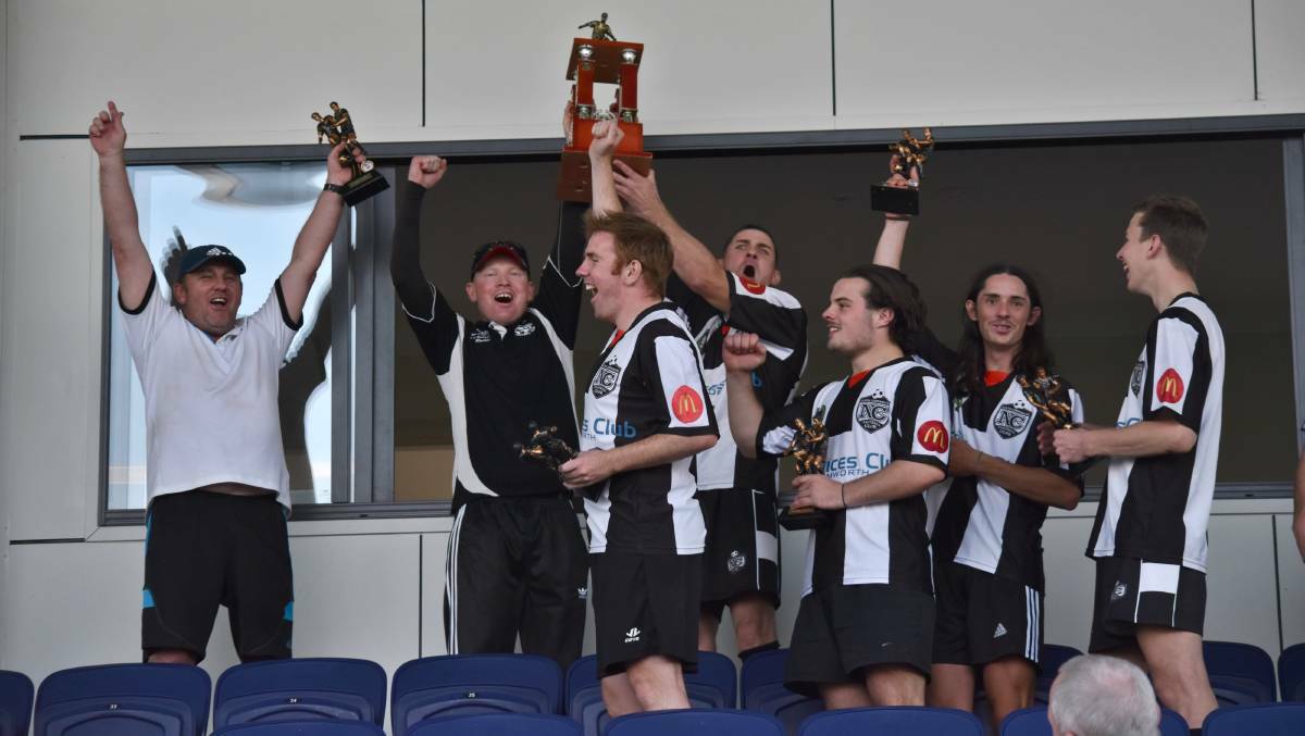OH YEAH: Gavin Thomson, far left, celebrates the 2017 grand final win. 