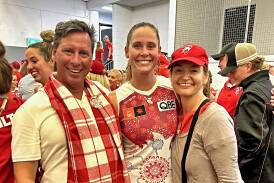 Alice Mitchell is joined by her parents, Duncan and Amanda, after the Swans' elimination final win over the Suns. Picture supplied