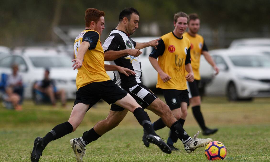TOUGH TEST: Demon Knight's Naran Singh in action against Companions last month. DK have drawn Byron Bay in the FFA Cup.