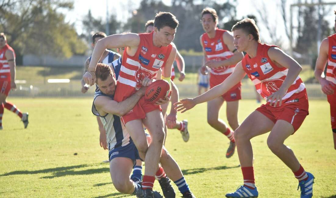 YOUNG BUCK: Swans coach Paul Kelly gave midfielder Ed George, 16, a wrap for "stepping up" this season. 