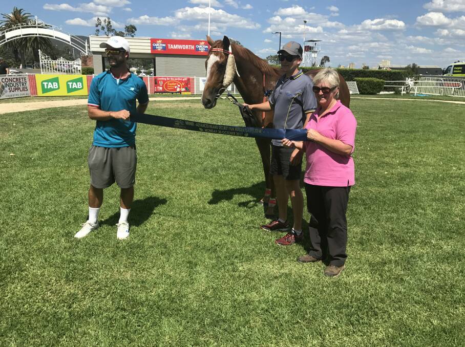 SUCCESS: Co-owners Mitch Poer, Todd Grills and Sue Grills with Not A Princess after the Tamworth mare's win on Monday: Photo: Contributed 