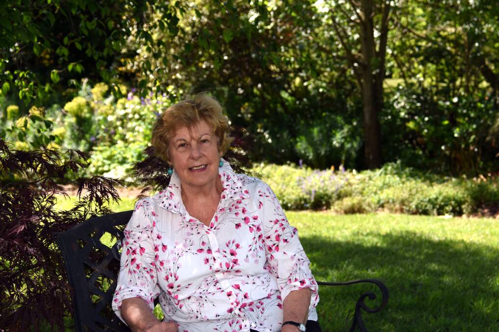 FLOURISHING GARDENS: Robyn Jackson in her garden 'Kooralbyn' in Guyra on Monday afternoon. Mrs Jackson will open her garden to the public this weekend to help St Mary of the Angels support Kolora. Photo: Rachel Baxter.