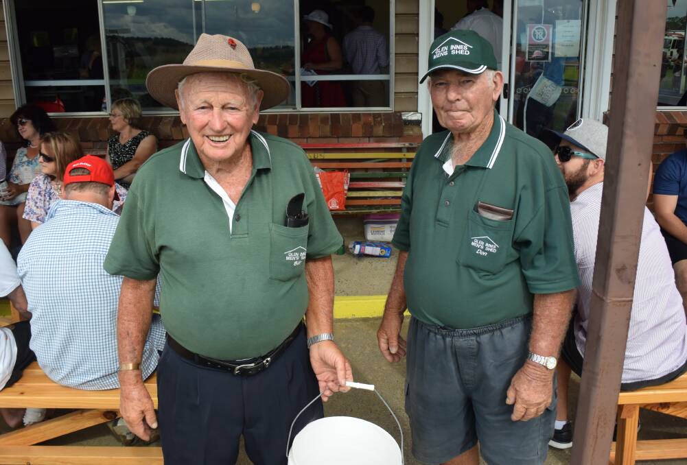 Hard at work: Bill Challen and Don Parker from the Glen Innes Men's Shed clean up.