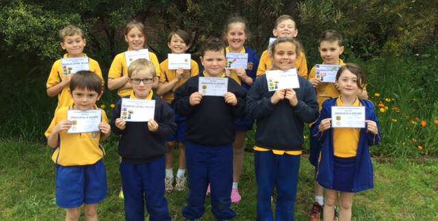 St Joseph's Quirindi: Smiling award winners with their certificates for a variety of different awards in the final week of the term.