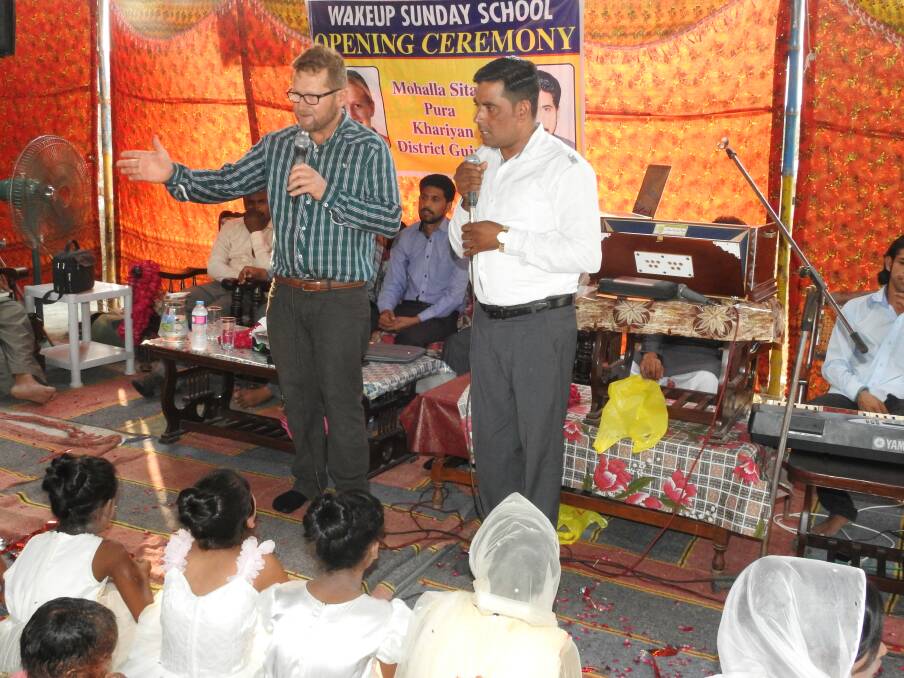 Spreading the word: Paul Disher preaching to the crowds in Pakistan through an interpreter.