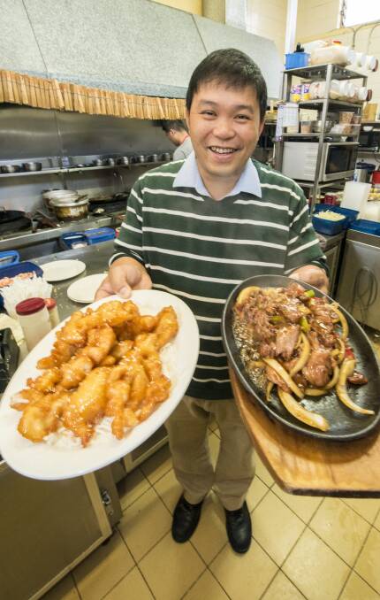 AWARD-WINNING: Marigold Inn owner Jimmy Lu shows off some dishes that saw the restaurant be named among the country's best. Photo: Peter Hardin 241016PHC014