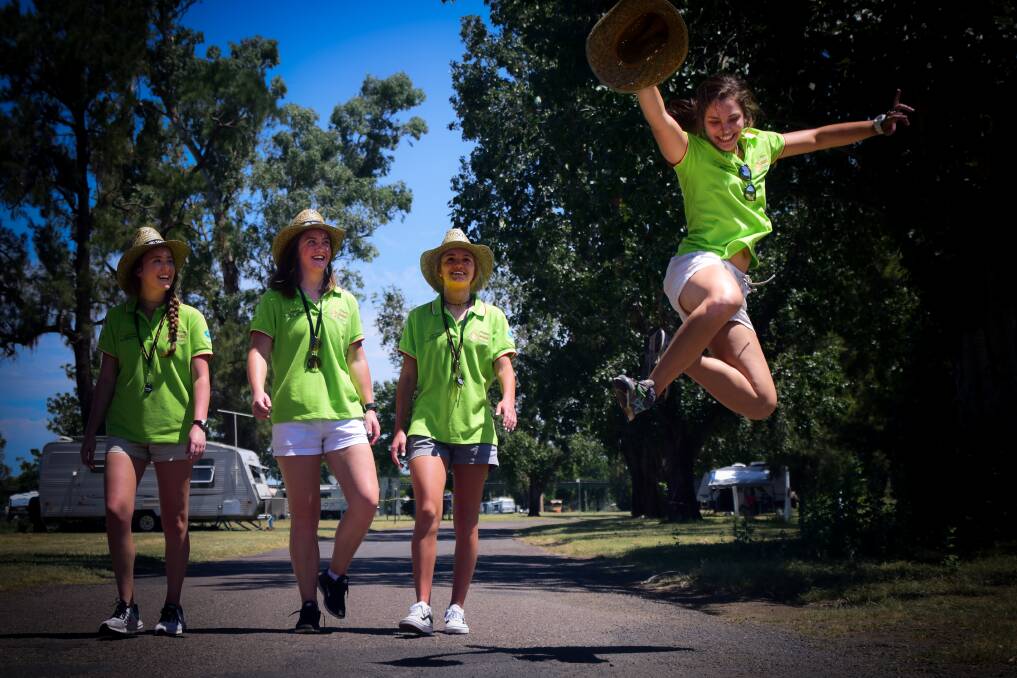 JUMP FOR JOY: Hailey Lund, 18, Kate Sullivan, 18, Olivia Tirrill, 17, and Evie Witty, 18, are out from Nashville for the Tamworth Country Music Festival. Photo: Simon McCarthy