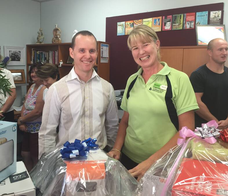 GIFT OF GIVING: CBA area manager for retail Michael Eekelshot and Tamworth Family Support Service general manager Belinda Kotris.