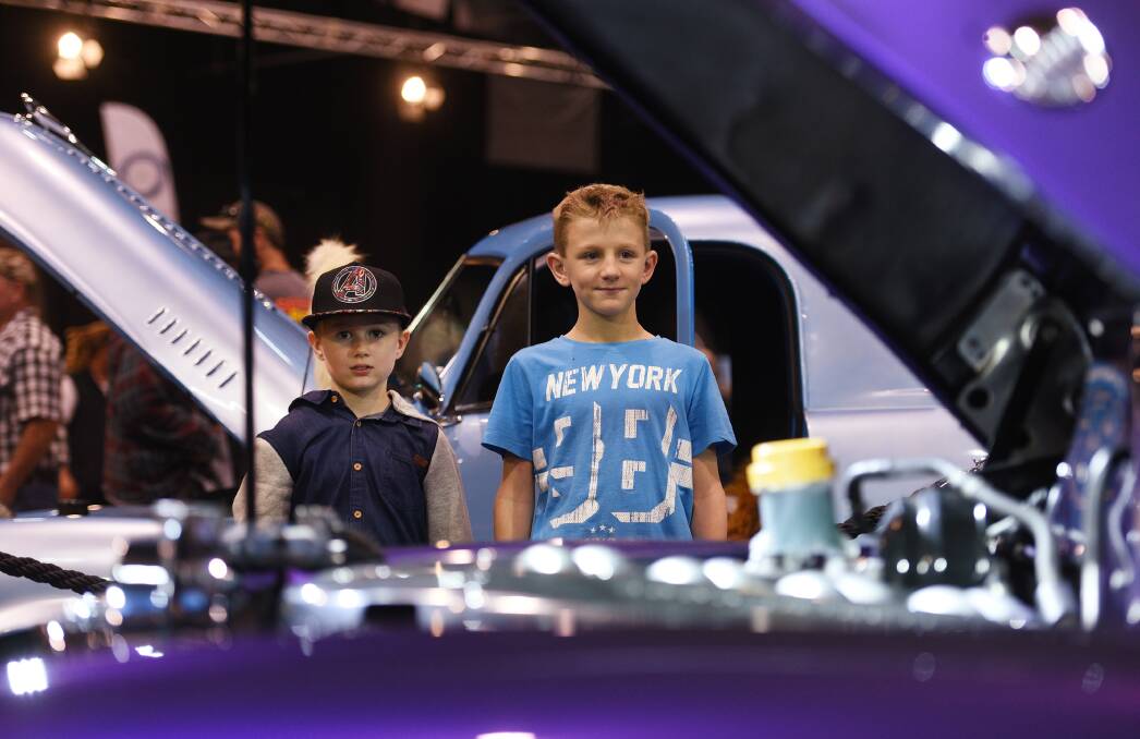 CHECK IT OUT: Charlie O'Neil, 7, and Cooper Darlington, 9, eye off the displays at Shannons Motor Show. Photo: Gareth Gardner