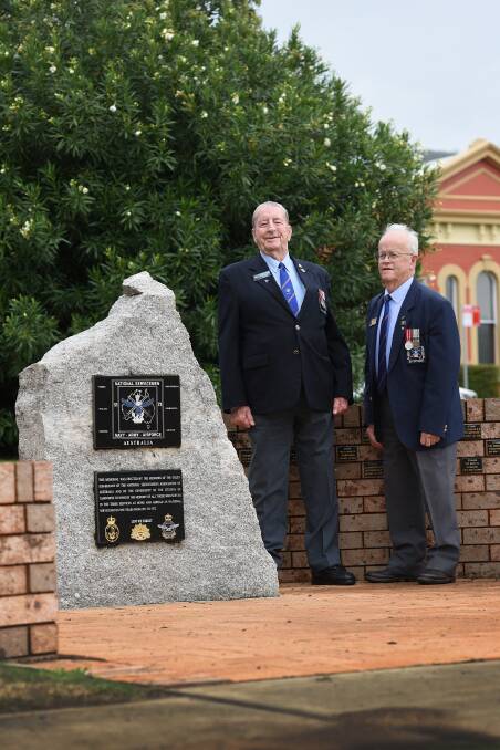 IN HONOUR: Don Smith and Jim Jordan at the Marius Street memorial to mark the 66th anniversary of National Service in Australia. Photo: Gareth Gardner 240317GGE03