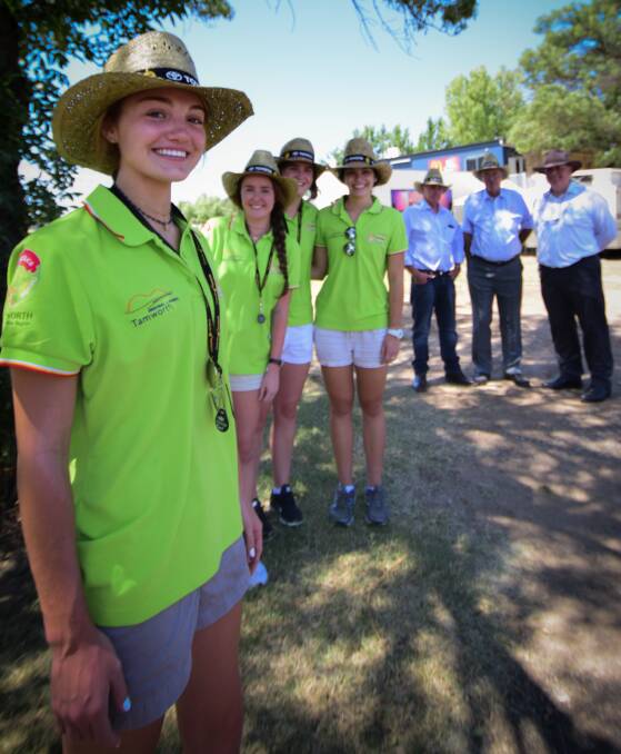 HELPING HANDS: Olivia Tirrill, Hailey Lund, Kate Sullivan and Evie Witty, with Tamworth councillors Phil Betts and Jim Maxwell, and TRC business and community director John Sommerlad. Photo: Simon McCarthy