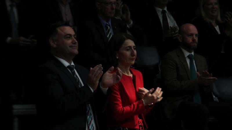 NSW Nationals delegates have voted to ditch the term 'Coalition' for better recognition of the party in government. Pictured is Deputy Premier John Barilaro and Premier Gladys Berejiklian during Friday's conference proceedings.