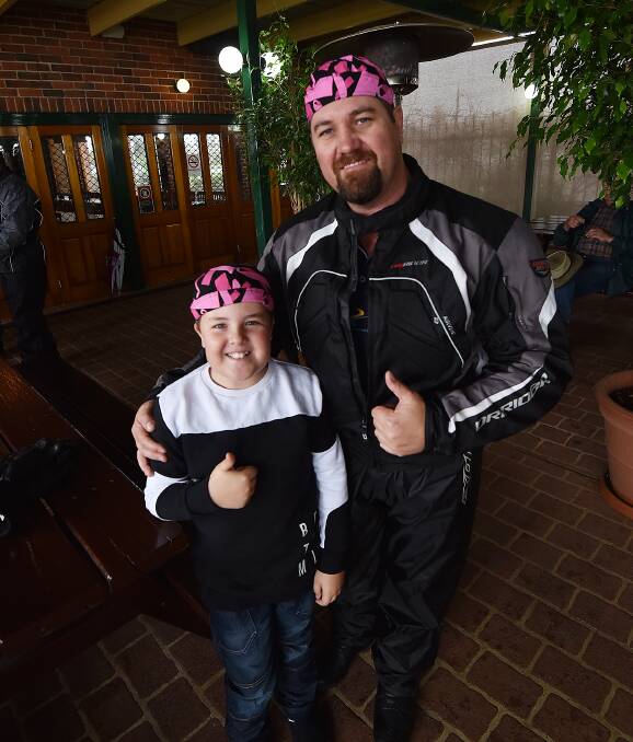 GOOD CAUSE: Father-son duo Ethan Bliss, 10, and Dean Bliss ahead of the Pink Ribbon Ride to raise money for the Cancer Council. Photo: Gareth Gardner 250916GGA12