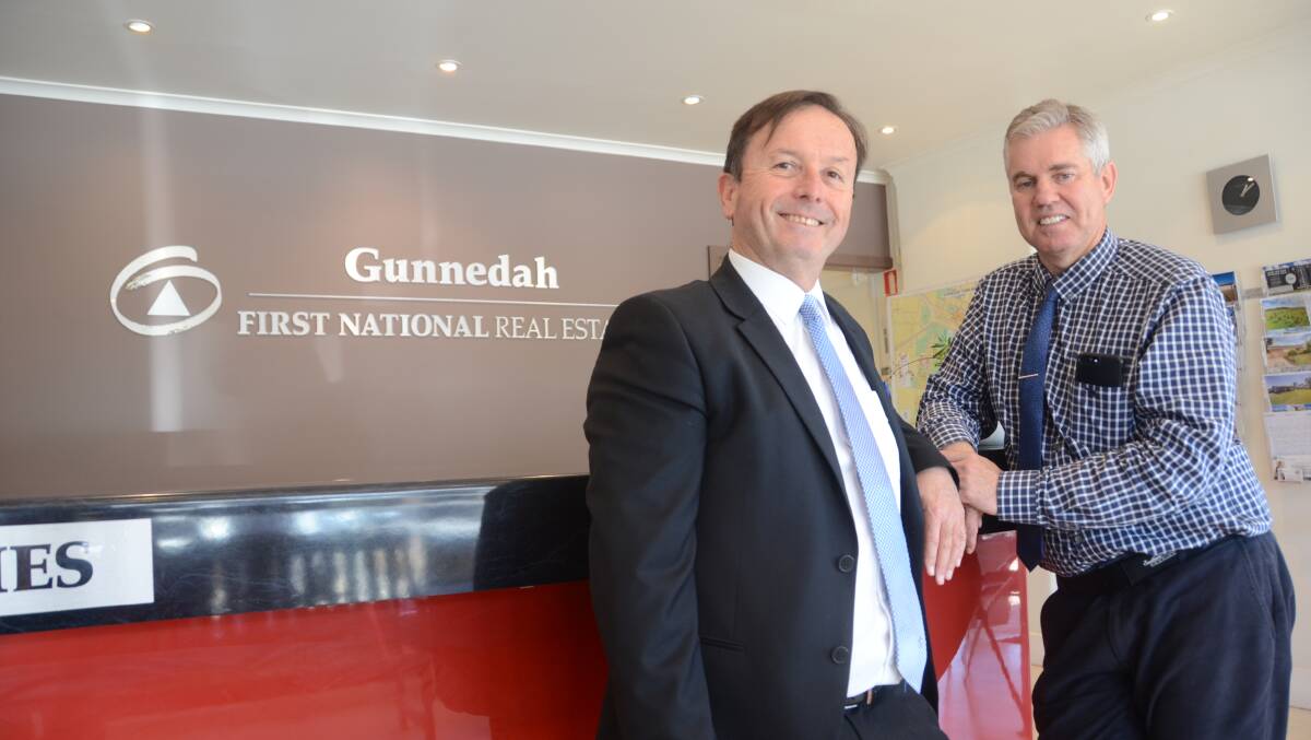 UNDER THE HAMMER: Gunnedah First National Real Estate's Mike Brady with First National Real Estate chief executive Ray Ellis. Photo: Ella Smith 