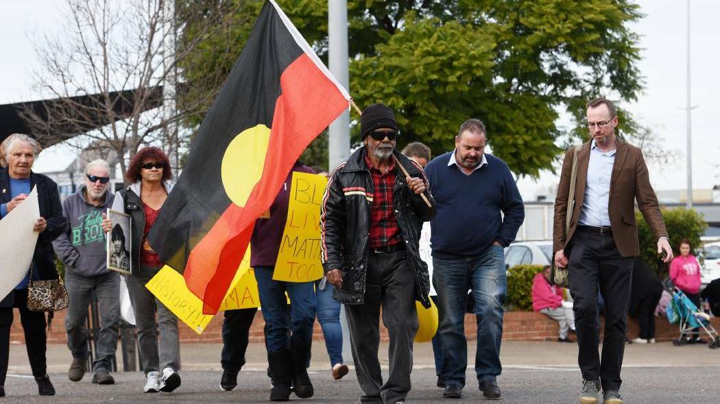JUSTICE: Mark Haines' relative Don Craigie marches to Tamworth police station in in June last year. Photo: Gareth Gardner