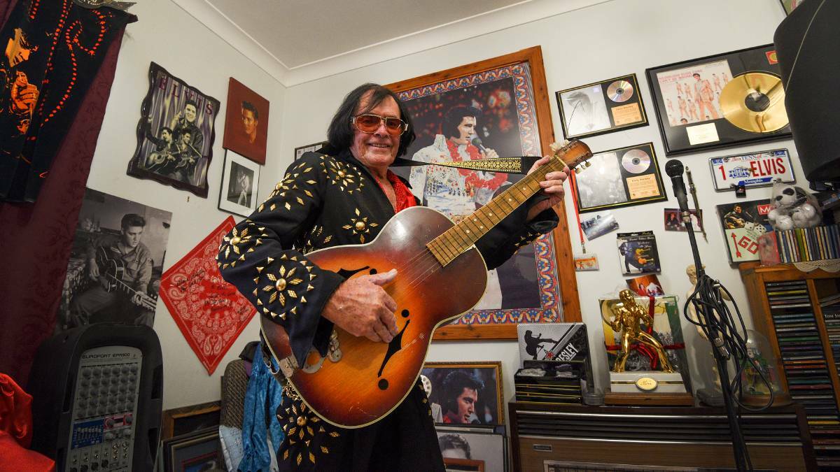 COMMITTED: John Caulfield at his home shrine to Elvis. Picture: Gareth Gardner