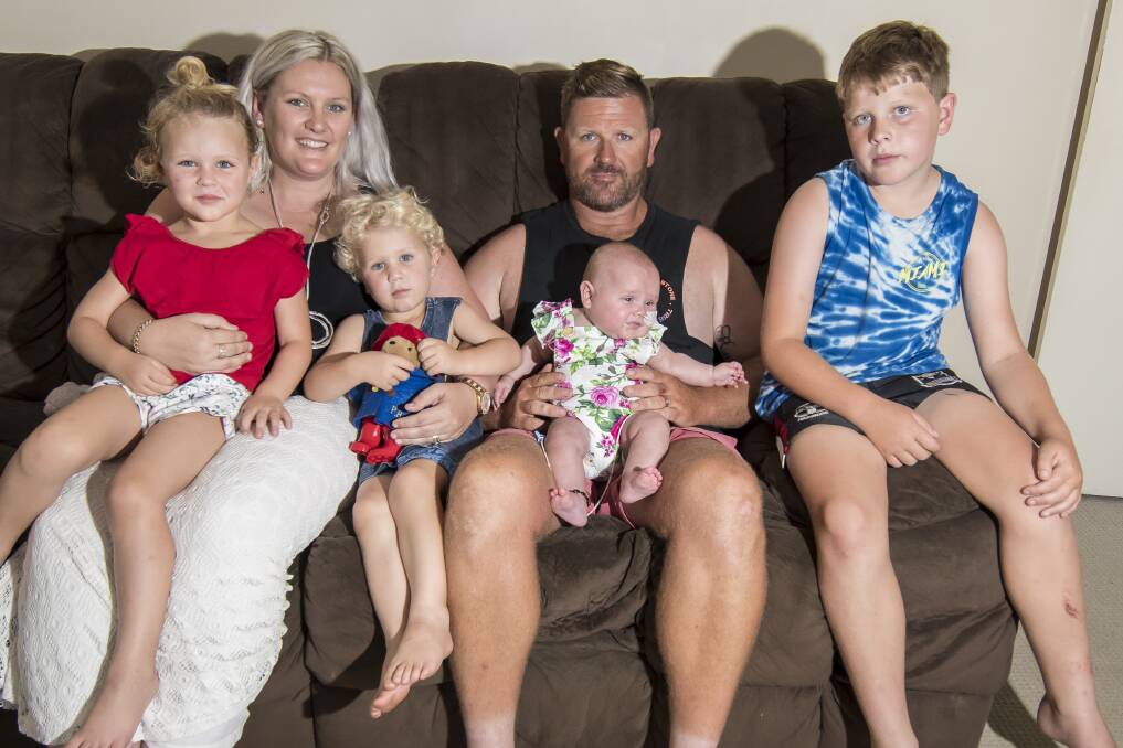 BACK TOGETHER: Poppy, Katie, Hendrix, Ryan, Lotte and Archie Moore at home in Tamworth. Photo: Peter Hardin