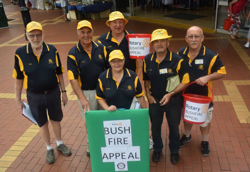 APPEAL: Rotary members Doug Hudson, John Robinson, Doreen White, Fred Edwards, Graham Tomlinson and Peter Little lead the bushfire appeal along Peel Street.