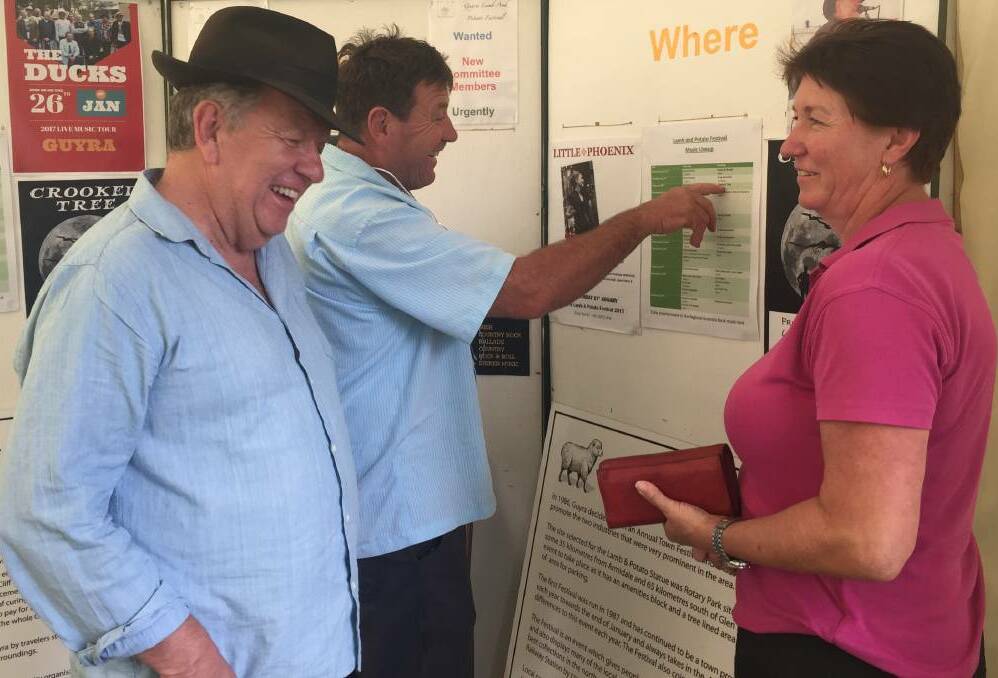 On the mend: Devil's Pinch singer and music program director Ian Russell pictured on the first day of the festival with Peter and Narelle Malcolm from Rafters Restaurant.