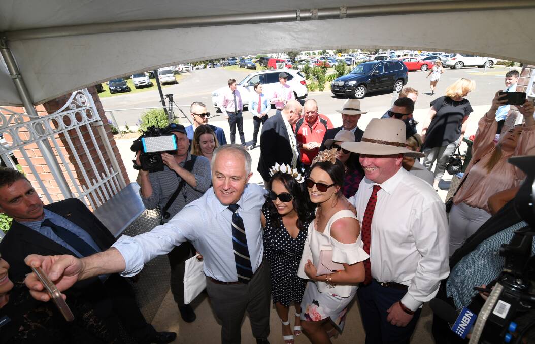 SELFIE TIME: Prime Minister Malcolm Turnbull snaps a selfie with Sally Simmonds, Danica Isaac and Barnaby Joyce. Photo: Gareth Gardner