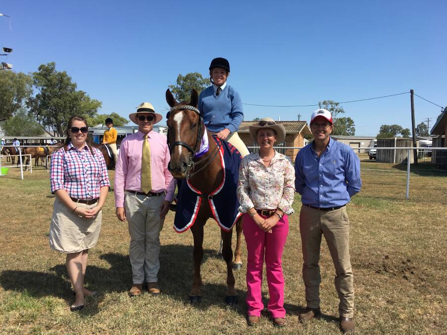 Tamworth MP Kevin Anderson (far right) announces a $25,000 grant to upgrade Tamworth Pony Club's amenities block on Saturday. He's pictured with champion supreme rider Sian Bricknell and judges Stephanie Edmonds, Nate Taylor and Nicole Whiting. 