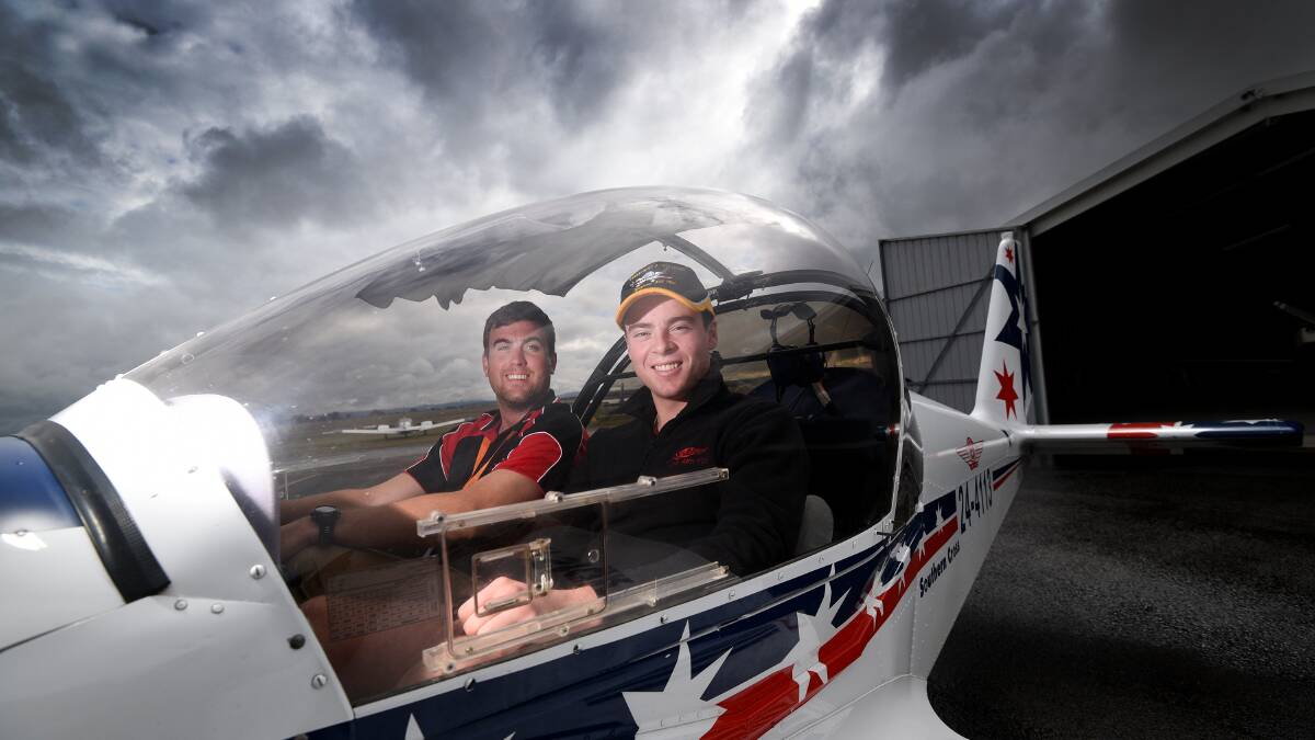 FLYING HIGH: Young pilot Josh Chisholm with Chief Flight Instructor Joris van der Heijden. Photo: Gareth Gardner