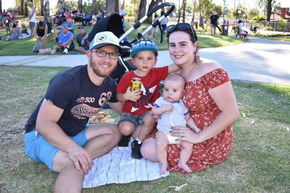 Brad and Ash Roberts with children Harry and Archer, of Tamworth, enjoy the Tamworth Family Support park concert on Saturday evening.