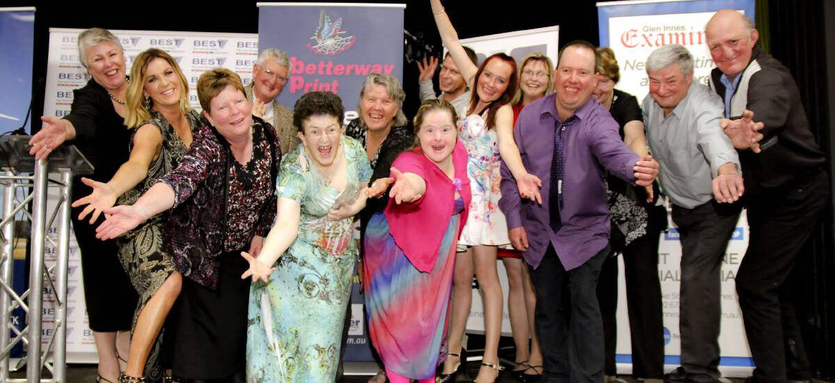WINNERS: The happy crew from Glen Industries with master of ceremonies Kylie Gillies. PHOTO Tony Grant