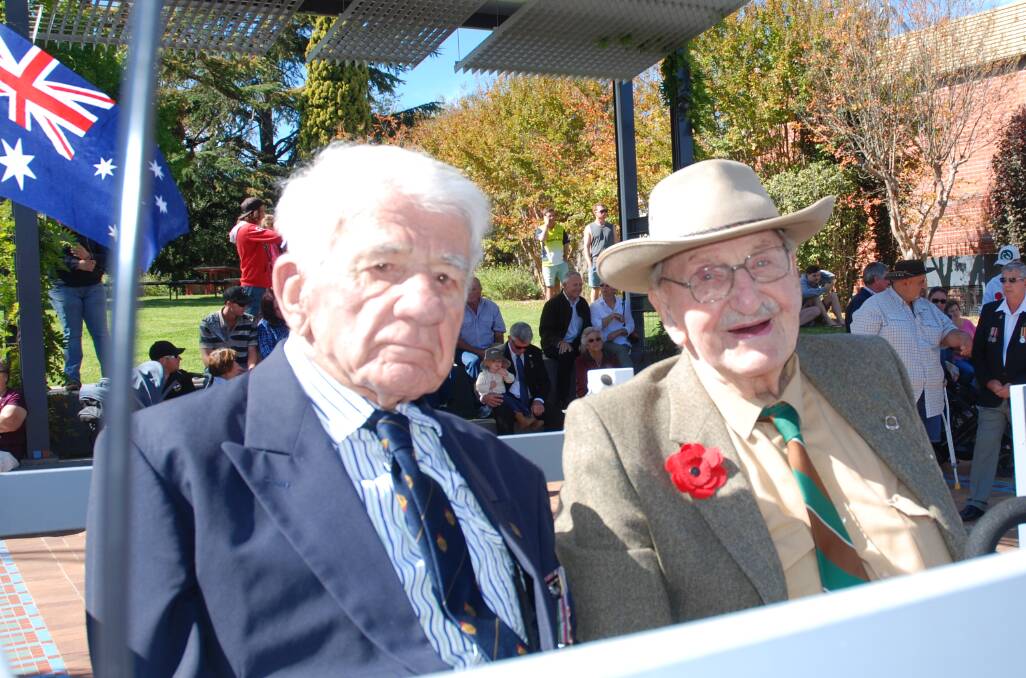 Bob Smith (on right) got his wish for fine weather for the Anzac Day march fulfilled as he and Dr Dick Keatinge prepare to take the salute.