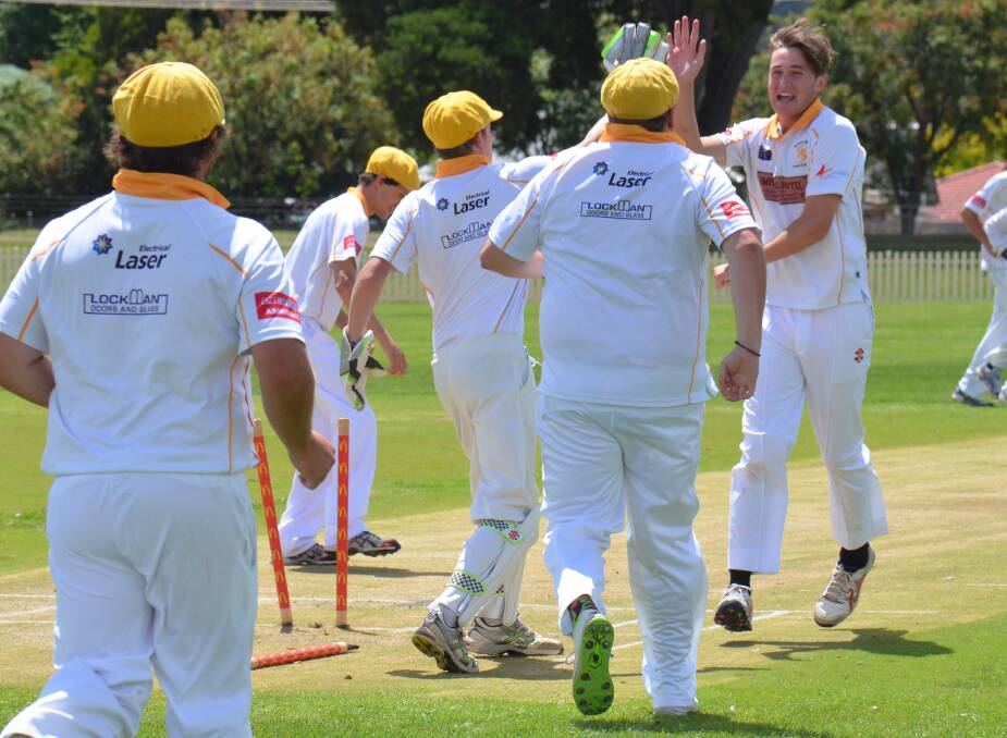 OPENING WICKET: Easts bowler Jackson Gwynne celebrates with teammates Dean Moore and Todd Francis after removing the middle stump of City batsman Simon Stubbs for the first scalp in the one day grand final.