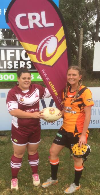 MAKING INROADS: South West Robins' Jodie Howarth and Uralla Tigers' Ella Elks at the first round of Group 4's nines. Photo: Country Rugby League. 