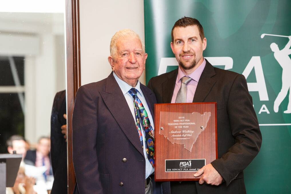 AWARD WINNER: PGA life member Tom Moore presents Armidale Golf Club's Andrew Walkley with the NSW/ACT Teaching Professional of the Year award. 
