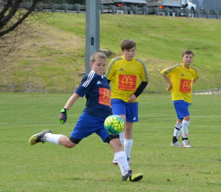 Under 11 France V Brazil: Inverell goalie Sam Hilton gets one away with support from team mates in the game against Toowoomba Grammar.