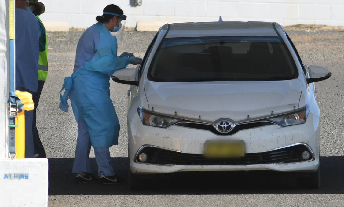 TEST BLITZ: The drive-through clinic set up at Tamworth hospital is aimed at ensuring authorities aren't missing any virus in the community. Photo: Gareth Gardner