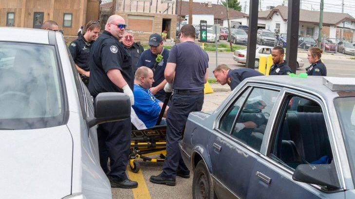 On Thursday afternoon, April 13, 2017, Dayton police and paramedics responded to a report of an unconscious man in the passenger seat of a car parked at a local business on East Third Street, Dayton, Ohio.