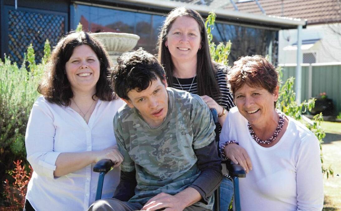 Changing philosophy: Mark Hill (centre) with his sisters Talia and Coreena Hill and Tracie Higgins. Mum Cheryl Hill says the current disability scheme doesn't consider people like Mark.