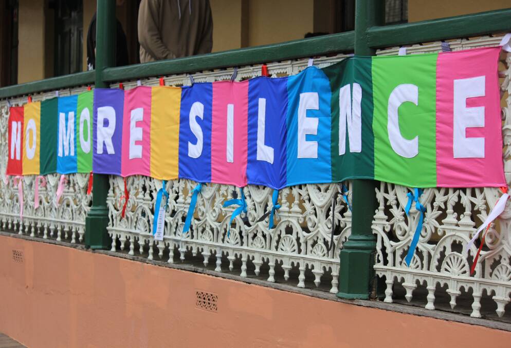 LOUD: The fence banner that reads 'No More Silence' aims to raise awareness for survivors of childhood sexual abuse. Photo: Madeline Link